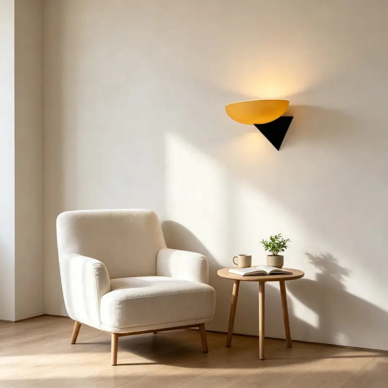 Bauhaus Retro Wall Lamp with amber frosted glass shade, casting warm light beside armchair for cozy reading nook interior lighting
