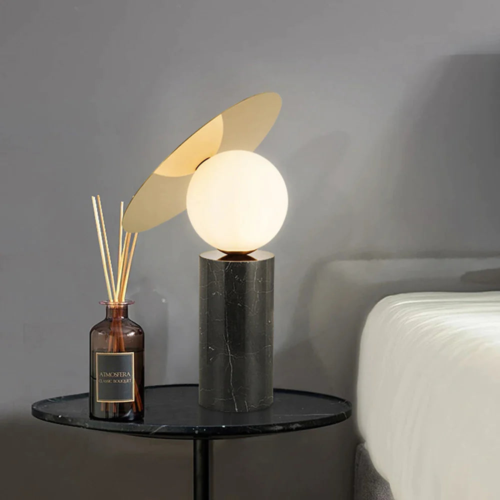 Bola_Disc_Table_Lamp made by marble is near a wine bottle
