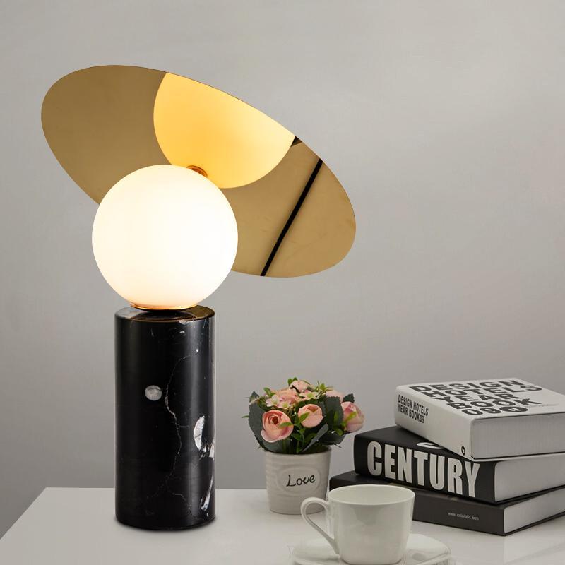 Bola_Disc_Table_Lamp_8 is near some books