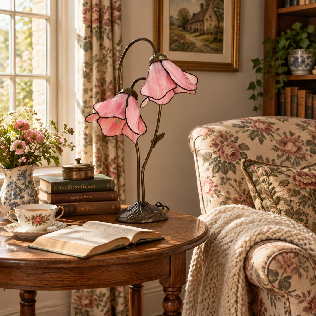 French country pink glass bellflower accent lamp on round tea table with tea cup decor