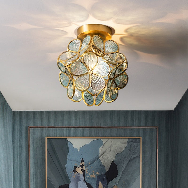 Floris Flower Ceiling Lamp featuring a delicate floral design, illuminating a stylish room decor.