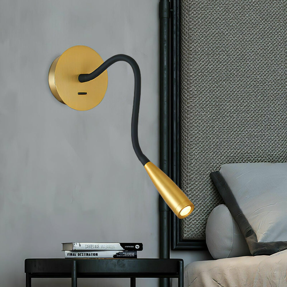 Goose Neck Wall Lamp with a minimalist curved arm and brushed brass finish, delivering precise warm lighting for bedside reading in a modern interior