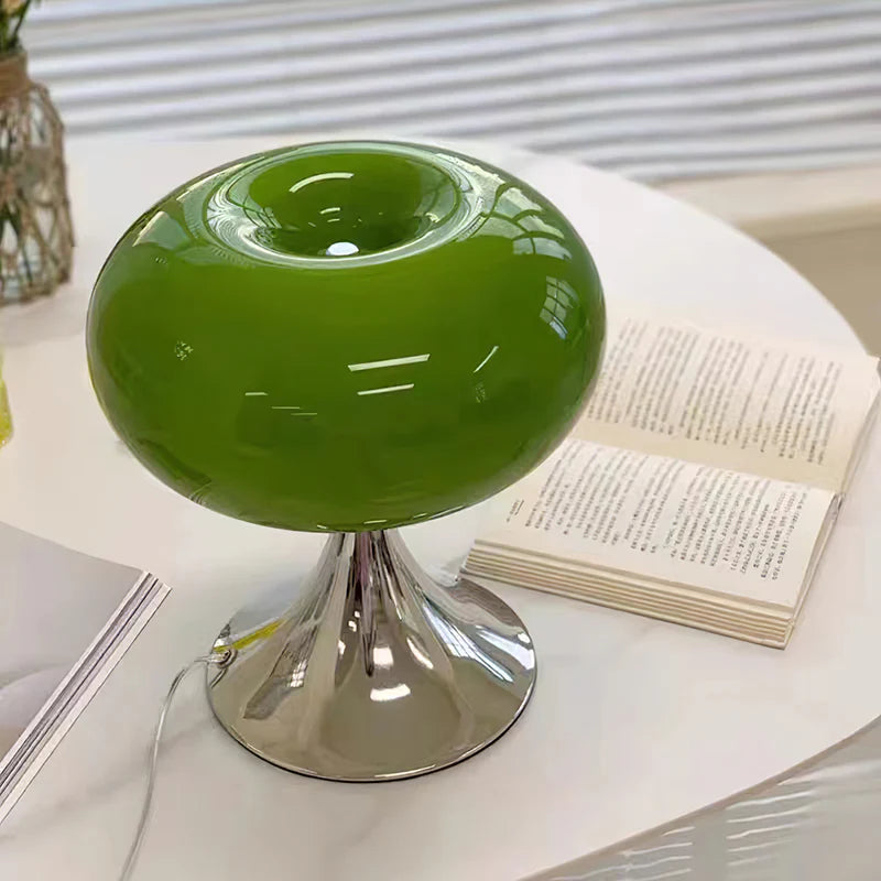 Green Apple Table Lamp is near a book