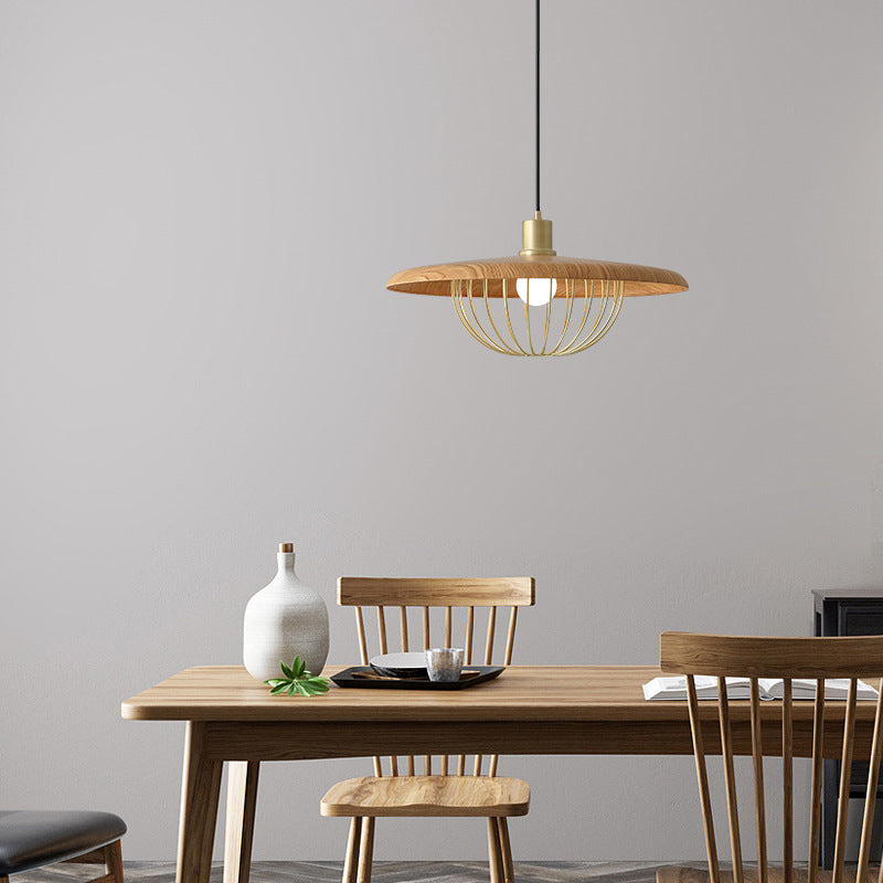 Japanese Retro Pendant Light illuminating a dining area with wooden table and chairs.