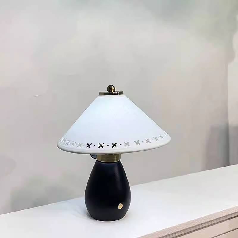 a table lamp made by fabric is on the table
