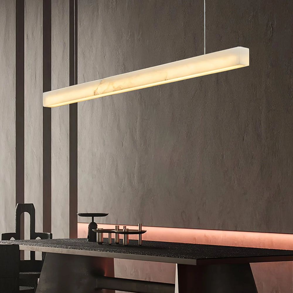 Linear Snowflake Stone Chandelier illuminating a modern dining area with elegant simplicity and soft light.