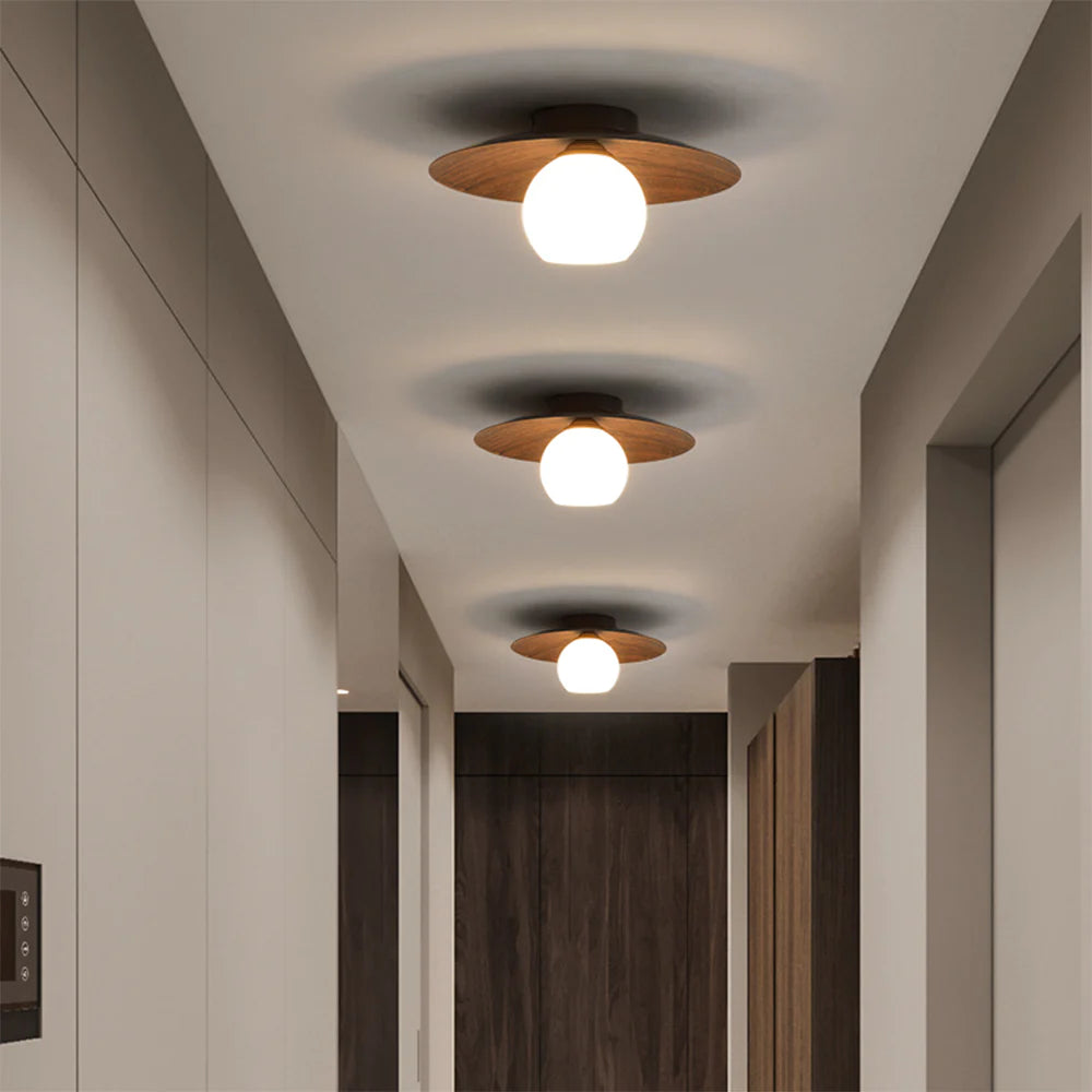 3 walnut wood color Ceiling Lights are in the corridor
