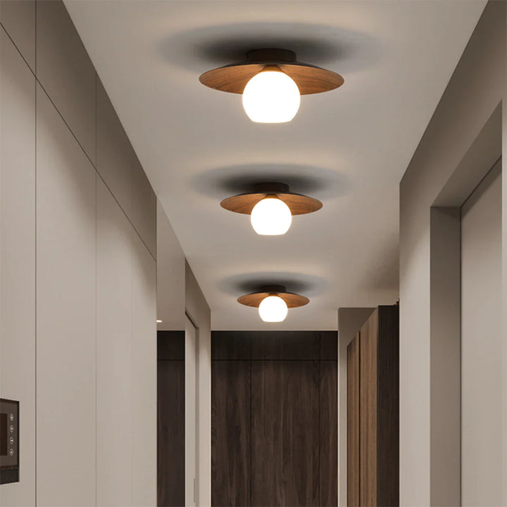 3 walnut wood color Ceiling Lights are in the corridor