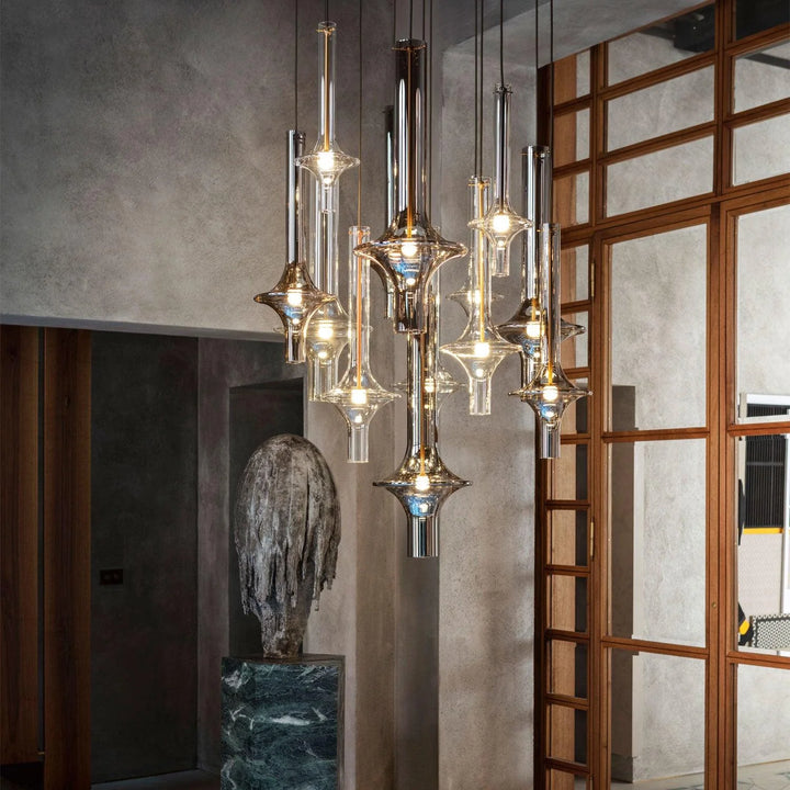 Miracle Star Pendant Lamp with clear and tinted glass, showcasing layered lighting in a modern interior setting.