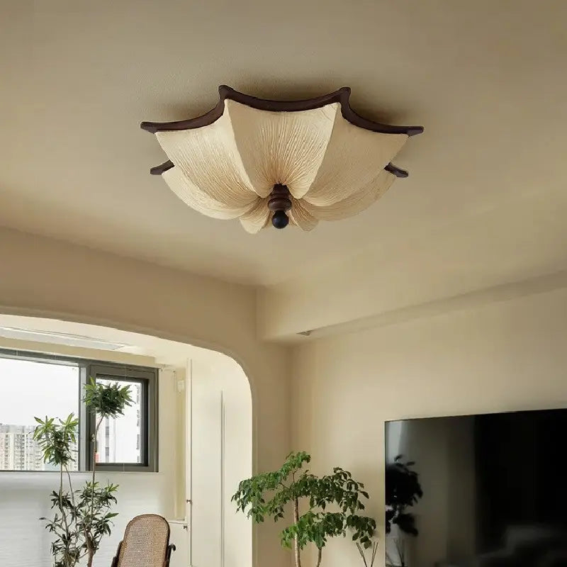 Modern Luvina Ceiling Lamp featuring pleated fabric shade and walnut-finish frame in a stylish interior.