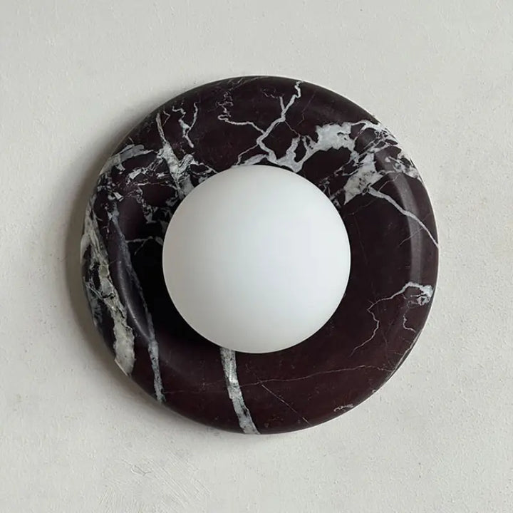 Modern Round Marble LED Wall Lamp with black marble backplate and silver natural veins, frosted spherical glass lampshade