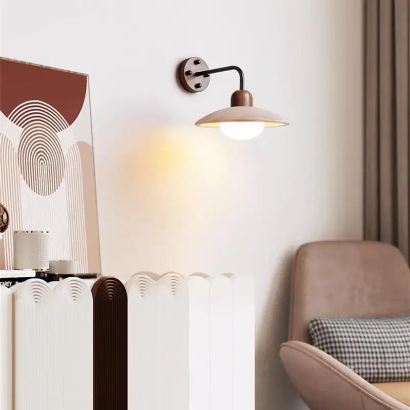 Modern Zarivo Wall Lamp illuminating a cozy living space with soft ambient light on the wall.