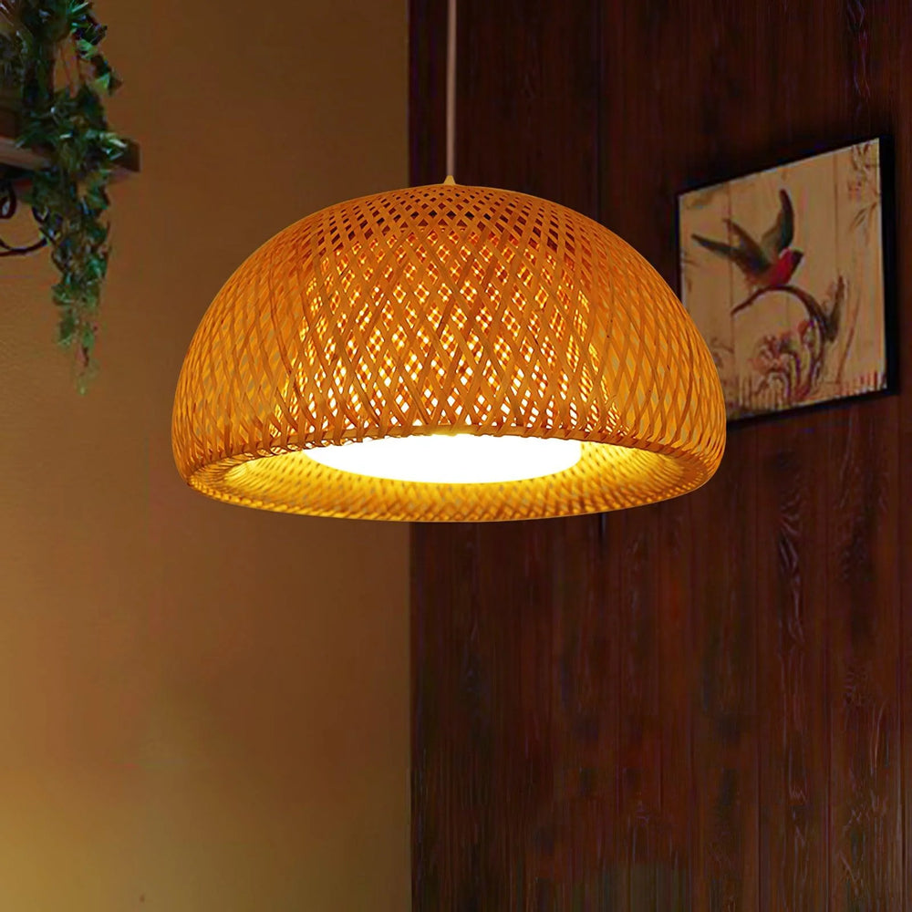 Bamboo basket pendant lamp with intricate design providing warm glow in a cozy room setting.