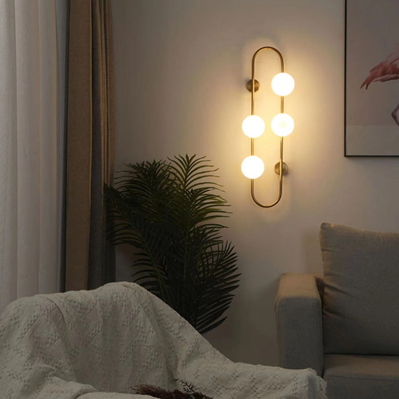 Oval Glass Ball Wall Lamp at night