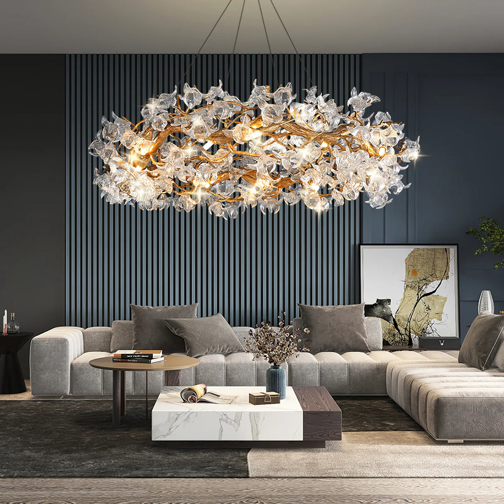 Petala glass branch chandelier hanging above gray fabric sofa for contemporary living room main ambient lighting