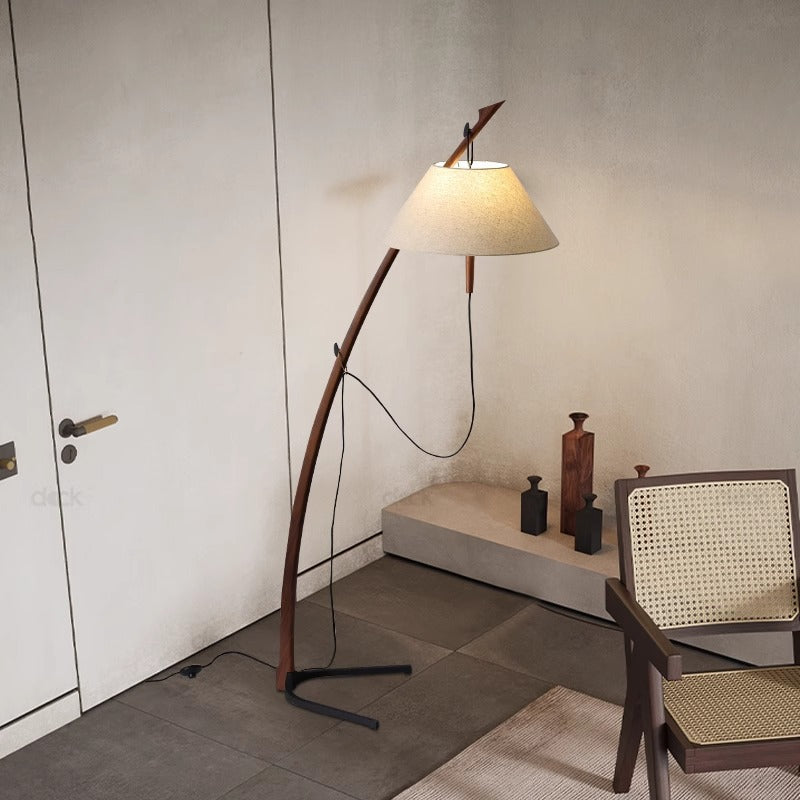 Sorvik Floor Lamp standing elegantly in a modern living room, showcasing its sleek design and warm lighting.