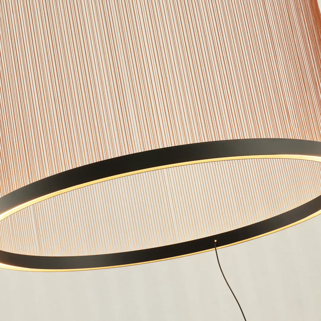 Spanish Cylinder Chandelier, close‑up view of illuminated warm‑white LED light ring along bottom metal frame behind vertical string shade