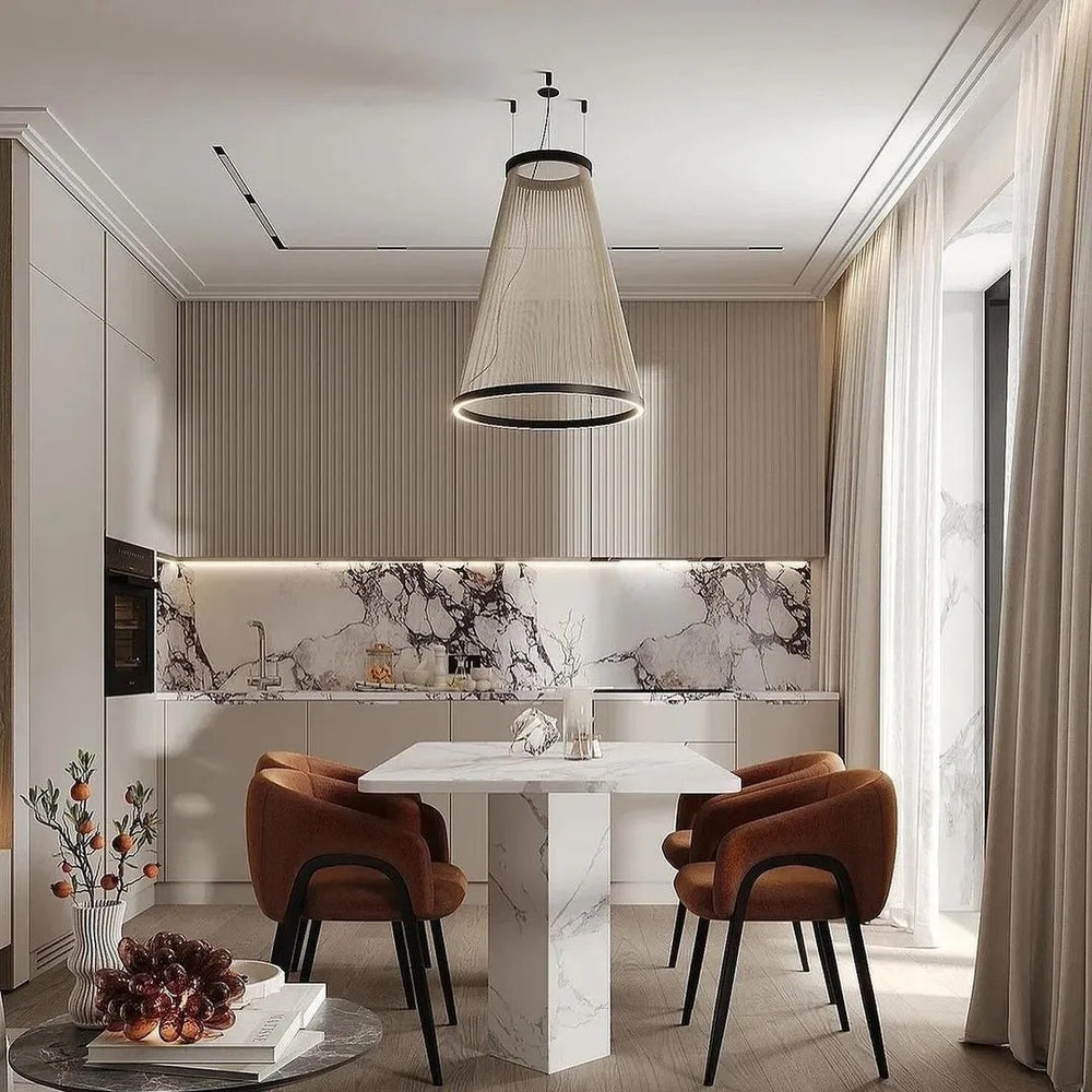 Spanish Conical Chandelier, fabric‑string conical pendant light with black trim, suspended over marble dining table inside bright contemporary kitchen‑dining space
