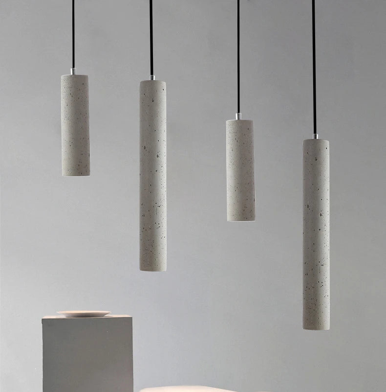 Strip Cement Pendant Lamp hanging in a modern interior, showcasing a unique artistic design with four cement shades.