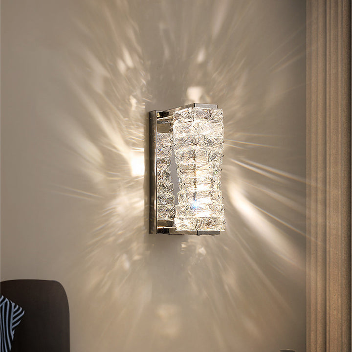 Vertical Crystal Glow Sconce illuminating wall with elegant light patterns in modern decor.