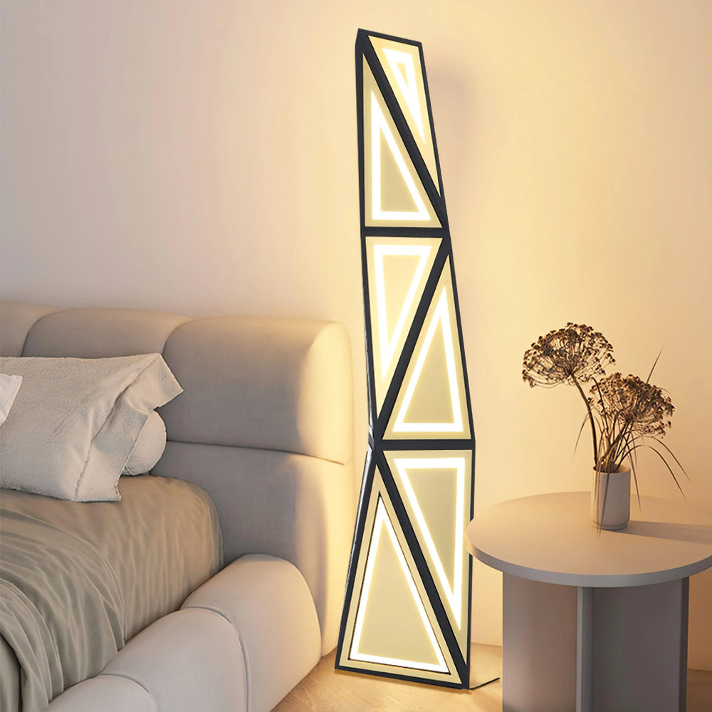Elegant Vertical Tapered Floor Lamp illuminating a modern living space beside a sofa and a decorative table.