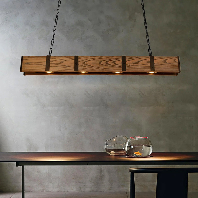 Vintage wood bar pendant lamp with chain suspension above a table in an industrial style interior