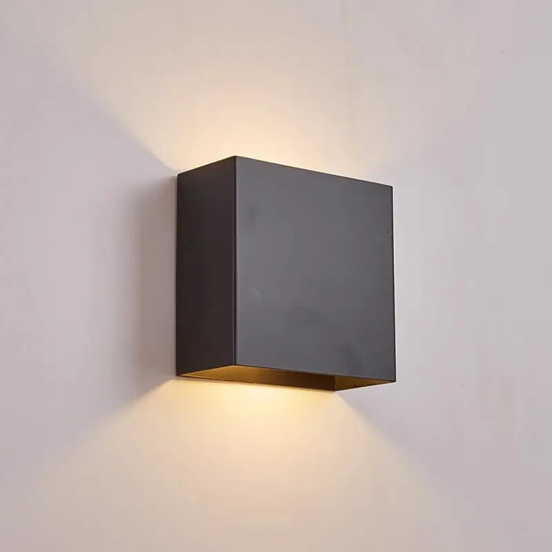 Matte black Volex cube wall light fixture with integrated LED delivering dual side lighting for contemporary indoor and outdoor space decoration