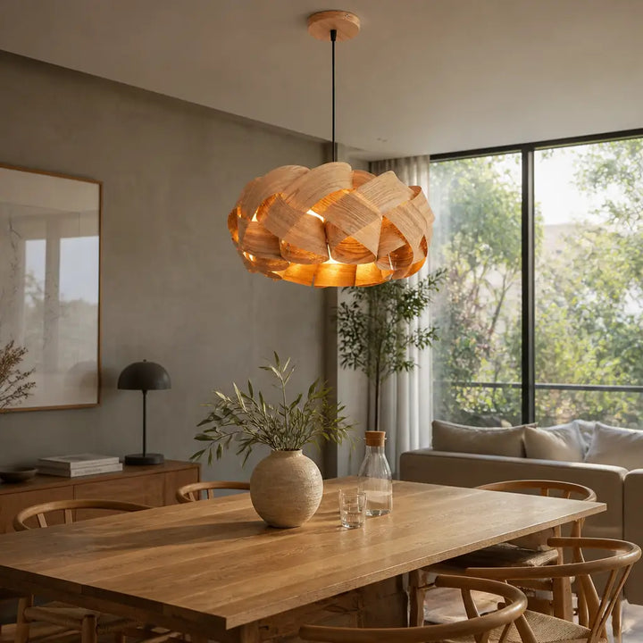 Modern wood wave pendant light glowing warmly in japandi living room near bookshelves